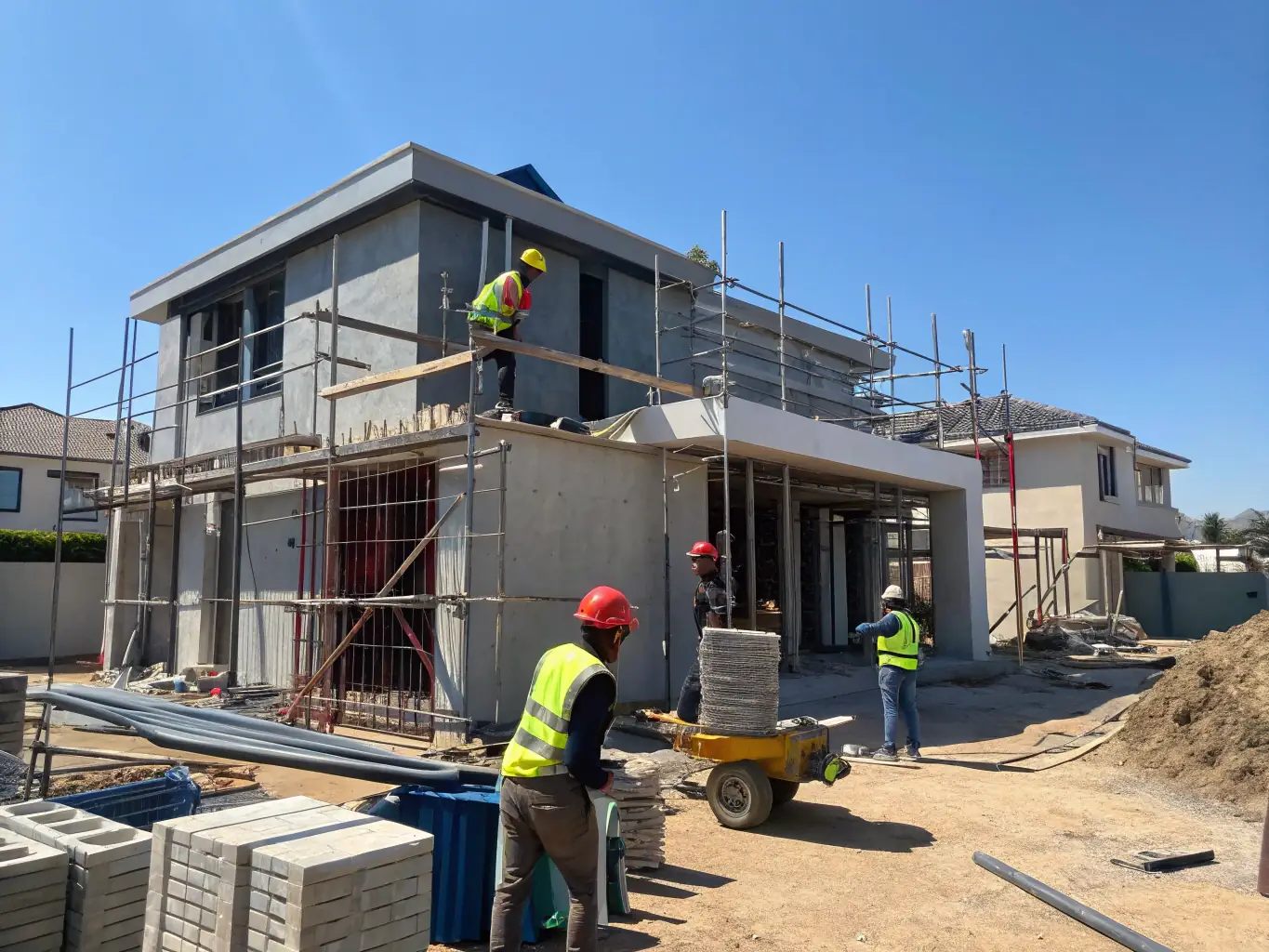 A photograph of a BuilderRex construction site, focusing on the meticulous attention to detail and quality craftsmanship in building a 3-bedroom house.