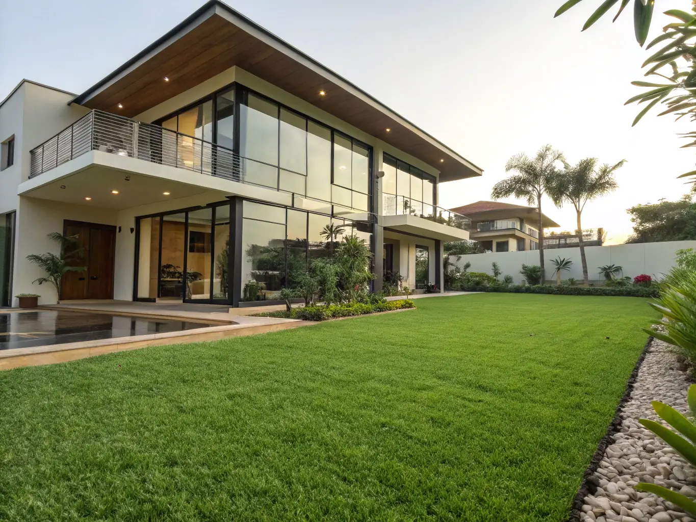 A well-maintained residential property in Ghana, showcasing BuilderRex's property maintenance services. The property features a manicured lawn, vibrant landscaping, and a clean, modern exterior.